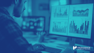 An HR leader reviewing workforce analytics dashboards on a large screen in a modern office