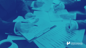 Professional team reviewing skills matrix on screen in modern office