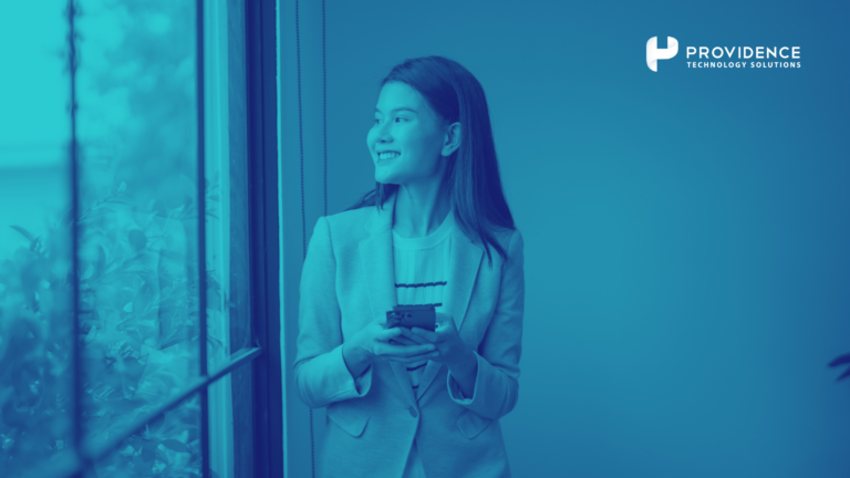 A frontline employee using a mobile phone to access HR self-service tools during a work shift.