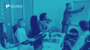 A project team reviewing an HCM implementation readiness checklist on a whiteboard in a conference room.